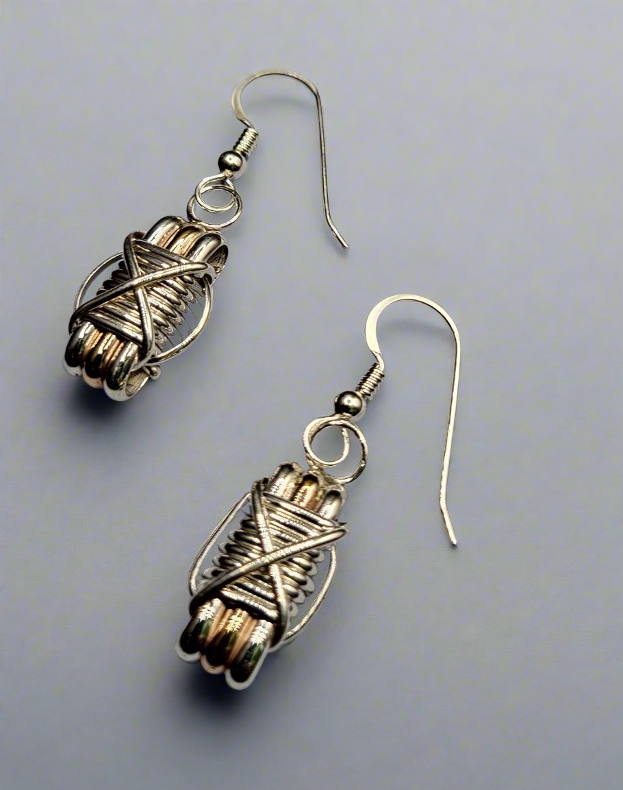 Elephant Hair Silver And Gold Strand Dangle Earrings On Light Background