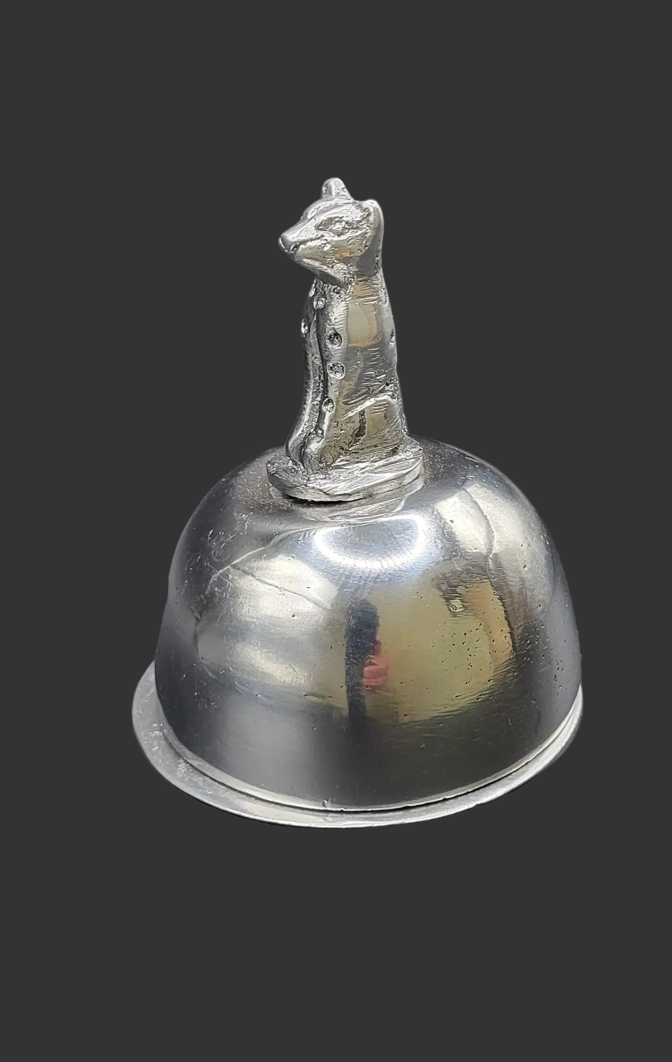 Silver butter dish with a small hyena on top 
