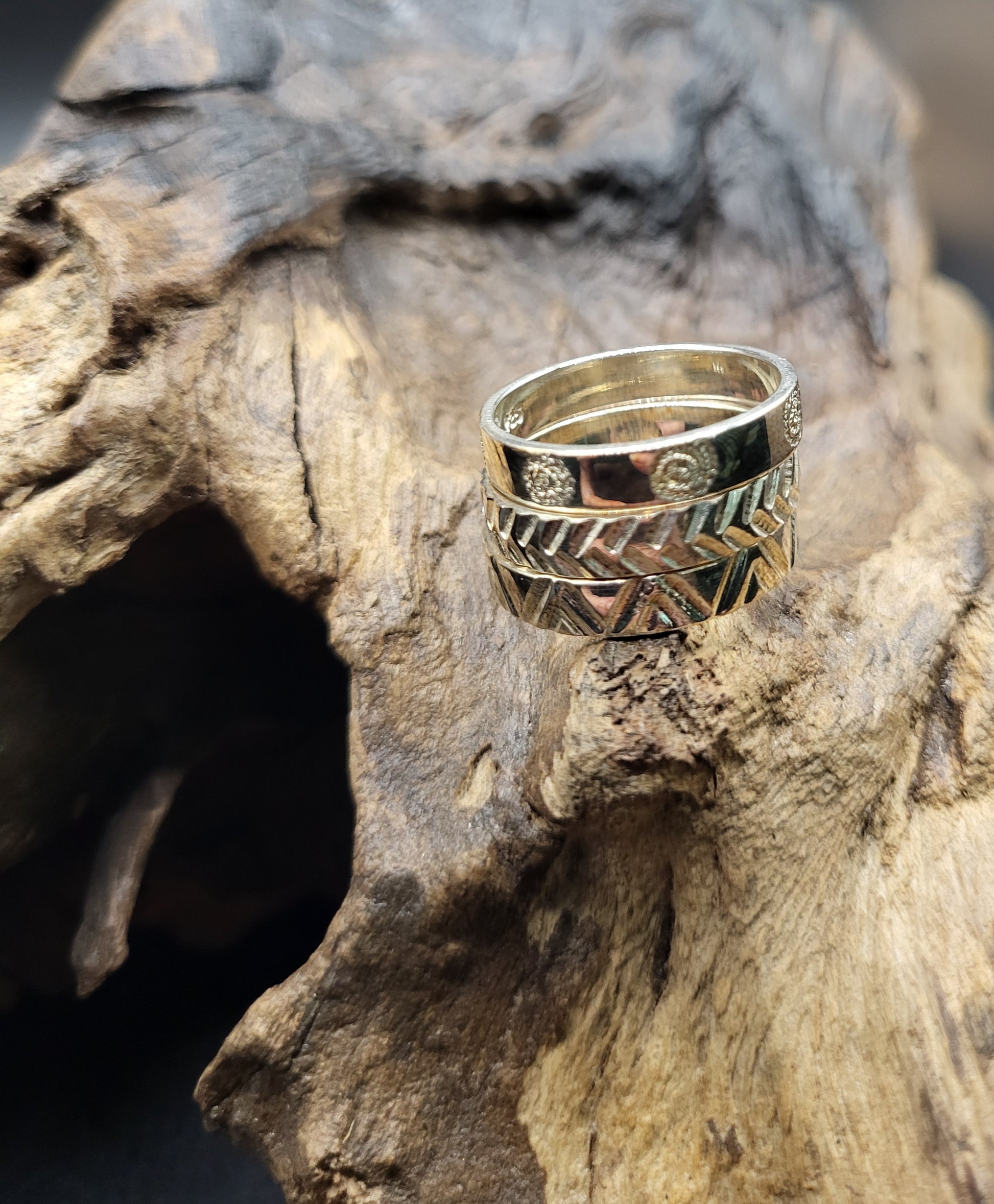 Silver Stacking Rings on Wood