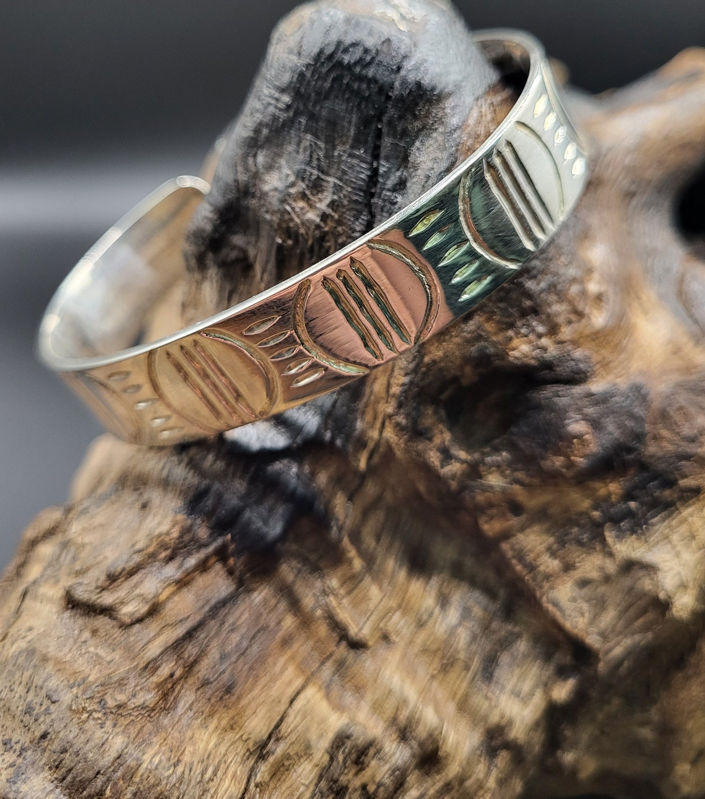 African Silver Pattern Cuff Bangle On Wood