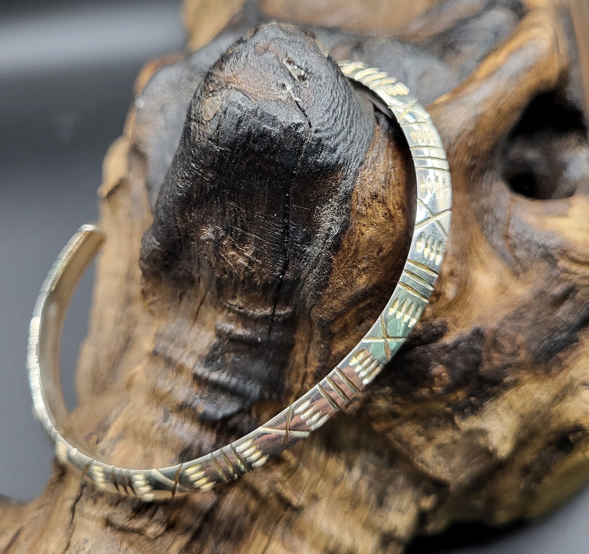 African Silver Cuff Bangle On Wood